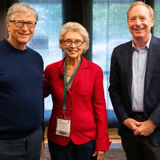 Bill Gates, former Washington State Governor and Challenge Seattle CEO Chris Gregoire, and Microsoft President Brad Smith pose at the 2022 annual conference.